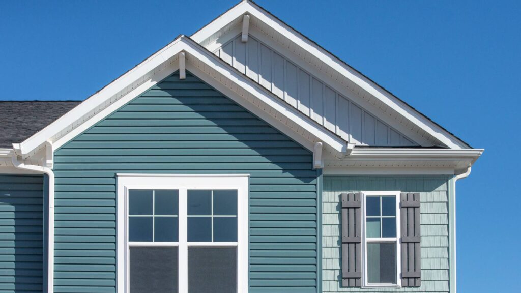 james hardie and vinyl siding on home in blue
